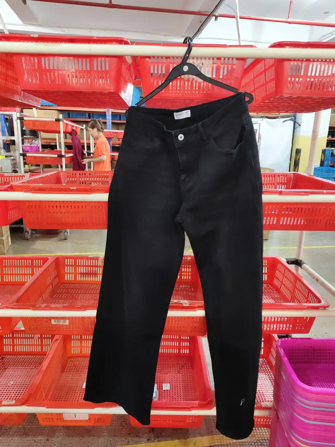 Black high-waisted wide leg stretch denim jeans with a classic five-pocket design and button closure.