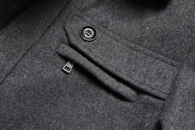 Dark gray woolen men wool winter overcoat quilted jacket featuring a black button and zipper detail.