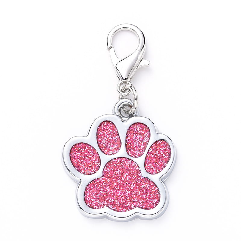 Pink glitter paw print metal dog tag with a silver-toned metal clasp.