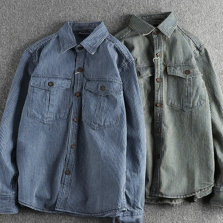 Two striped denim shirts for men featuring blue and white stripes with brown buttons and green and white stripes with brown buttons.