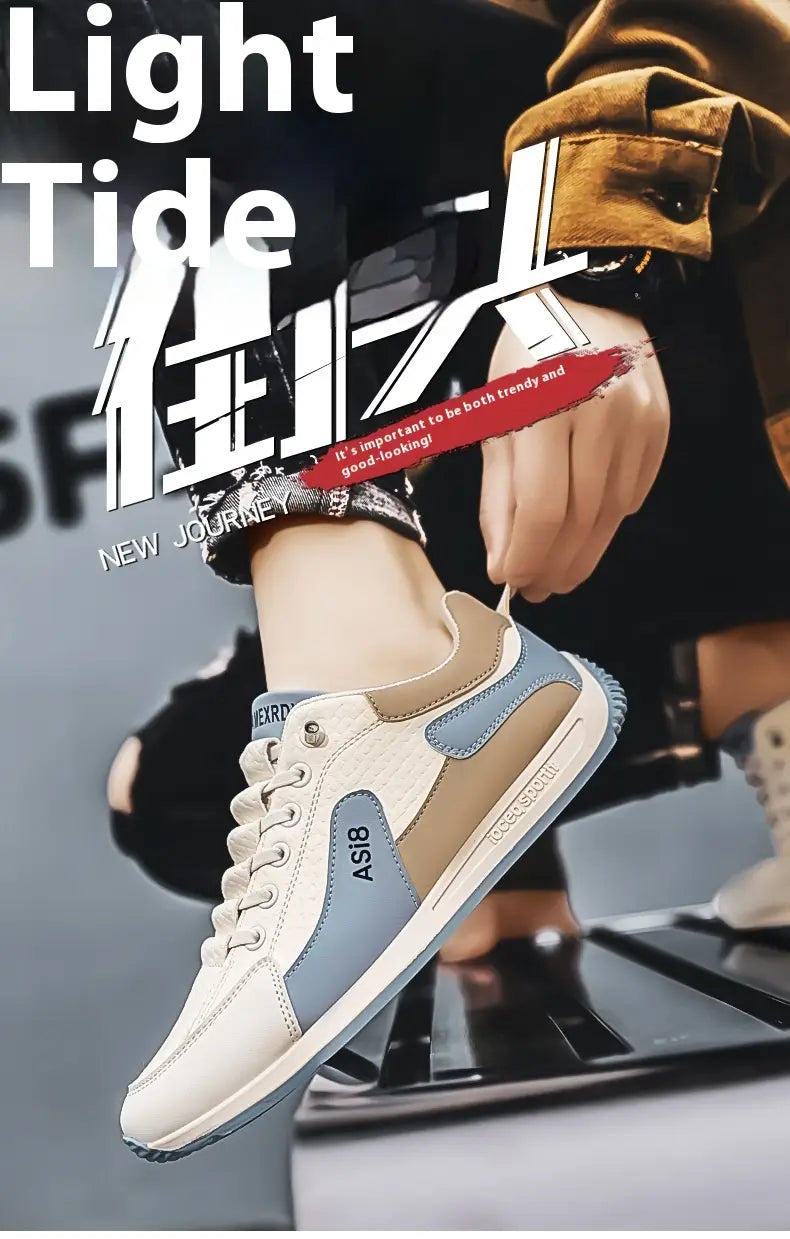 Men’s casual sports sneaker in white and light blue with beige accents featuring a textured microfiber upper and non-slip rubber sole.