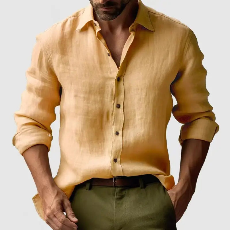 A men’s slim fit mustard-yellow linen blend button-down shirt with rolled sleeves and dark brown buttons designed for casual wear.