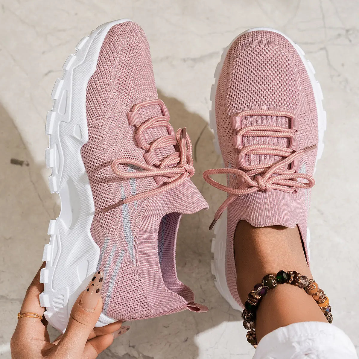 women’s lightweight breathable mesh lace up sports shoes in gray knit with chunky white sole and pink accents