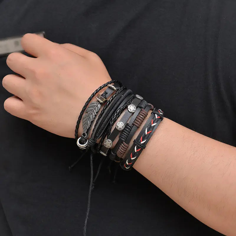 mens multilayer leather bracelet featuring black leather and braided cord wristbands with silver toned metal star charms