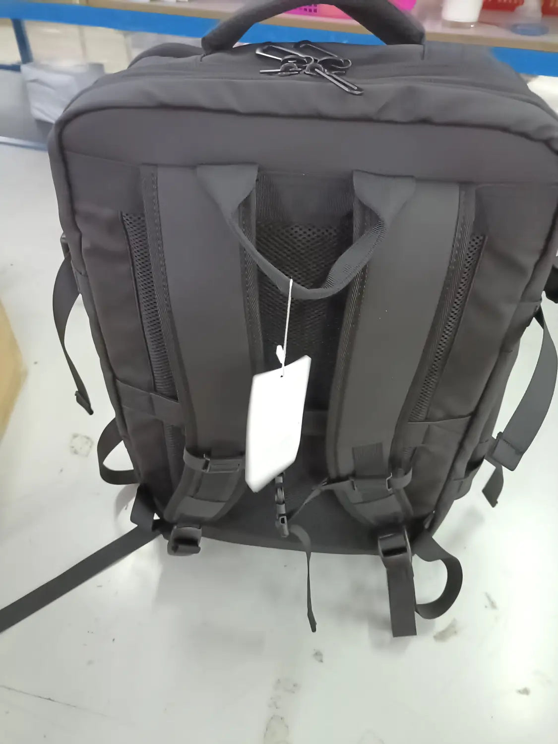 Dark gray durable fabric Bange 16 inch waterproof laptop travel backpack shown from the back with padded shoulder straps and top handle.