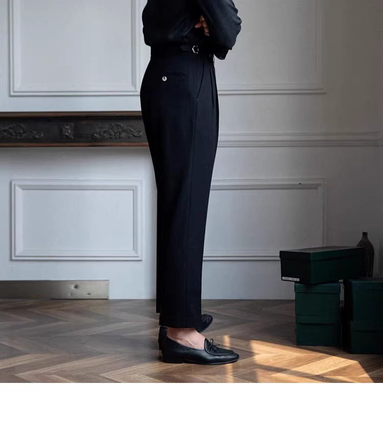 Black tailored men’s slim fit pleated summer linen suit trousers featuring a sleek straight-leg cut and subtle pleats at the waist.