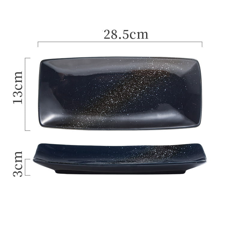 Black ceramic rectangular sushi plate with a glossy finish and scattered gold glitter ideal for Japanese ceramic sushi trays.