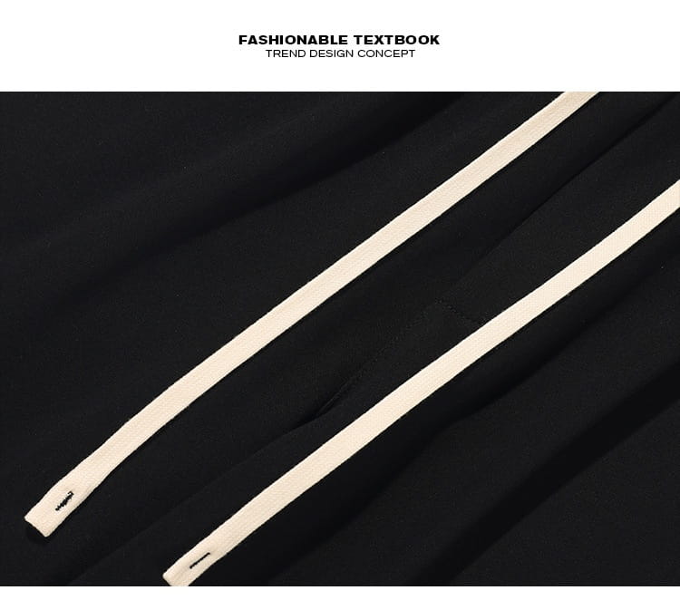 black fabric wide leg striped track pants featuring two parallel cream-colored zipper pulls on the back side