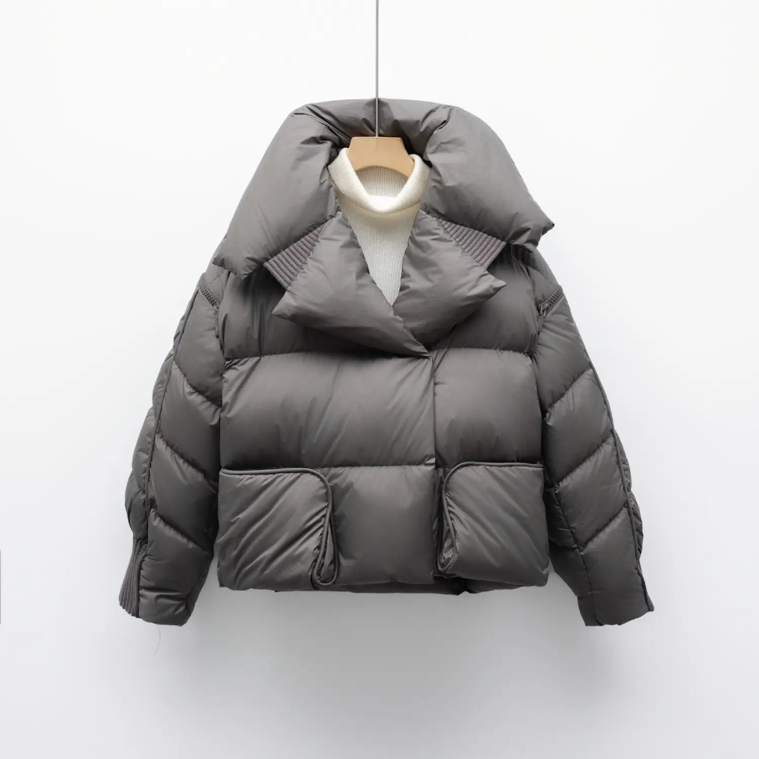 Dark gray quilted puffer down jacket with plush oversized hood and ribbed collar detail in Korean style.