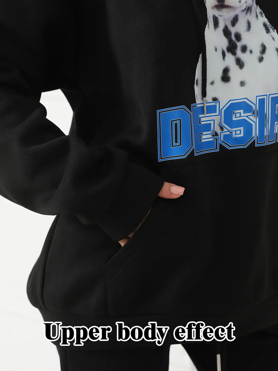 Black women’s hoodie featuring a large blue lettering graphic and a dalmatian print with a cat ear hood.
