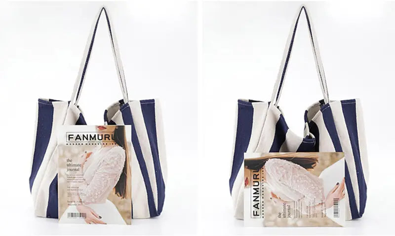 A navy and white striped canvas tote bag with sturdy handles designed as a high capacity shoulder bag.