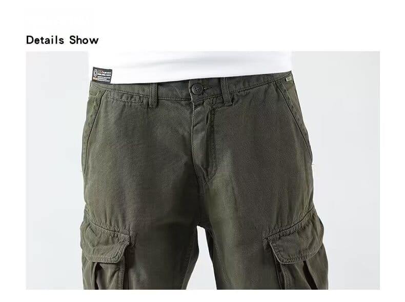Men’s relaxed fit olive green cargo shorts featuring multiple pockets and a button closure perfect for casual outdoor wear