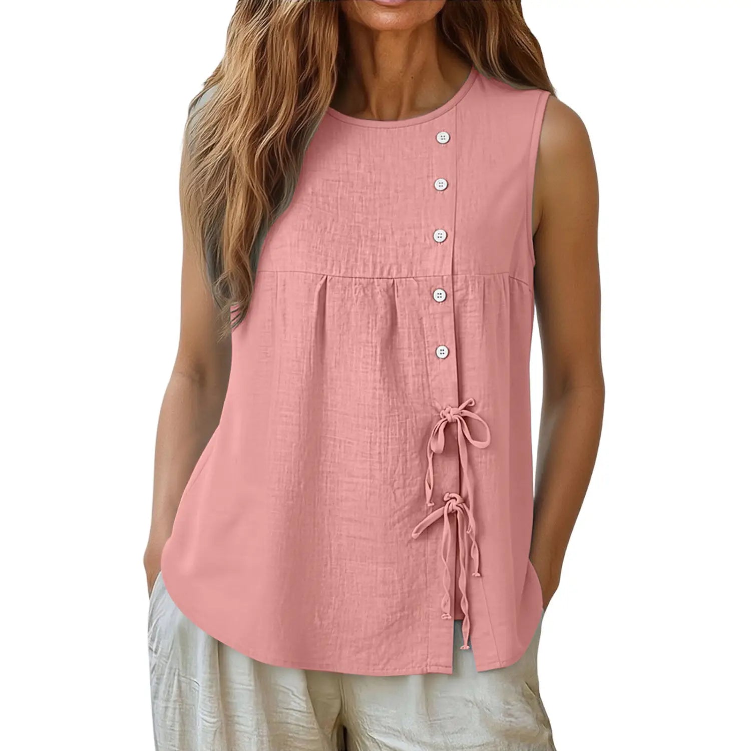 A soft pink sleeveless blouse featuring a button-down front and tie details at the hem.
