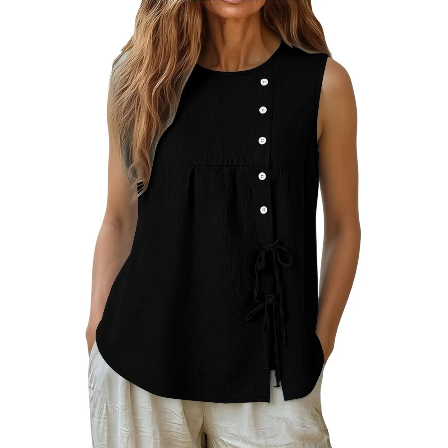 Black sleeveless tie side button down blouse with white buttons and a tied waist detail in a lightweight fabric.
