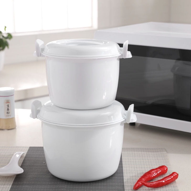 white plastic microwave rice cookers with steamer lids and side handles stacked one atop the other