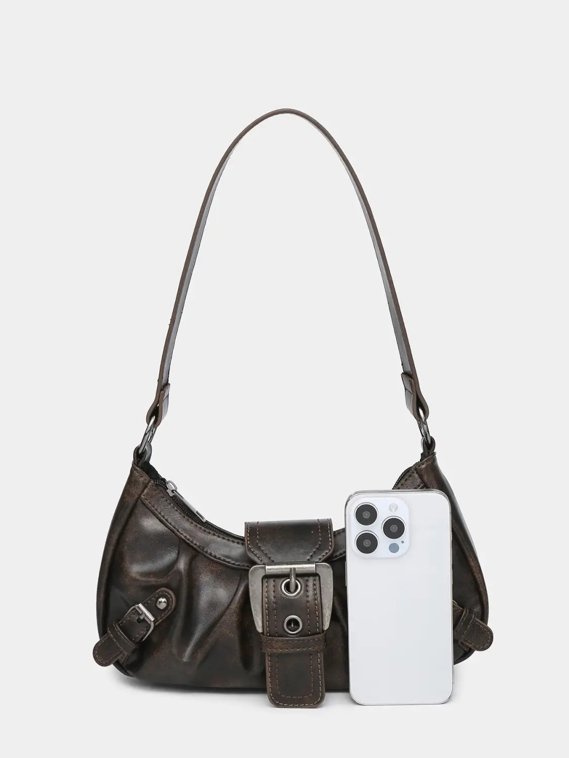 Dark brown vintage leather shoulder bag with a prominent silver toned buckle and matching strap.