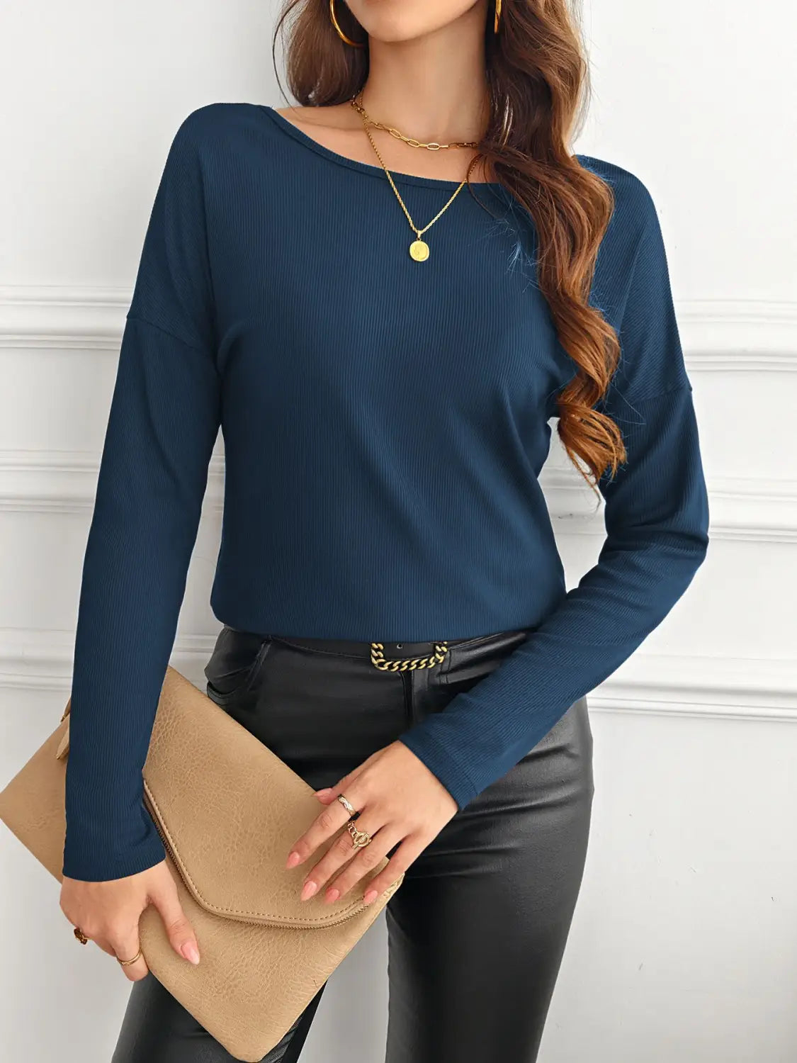 navy blue ribbed long sleeve top featuring butterfly lace back detail displayed from the back side