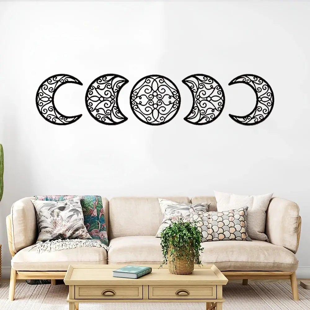 Black metal wall art featuring five intricately designed moon phases in a modern decorative series.