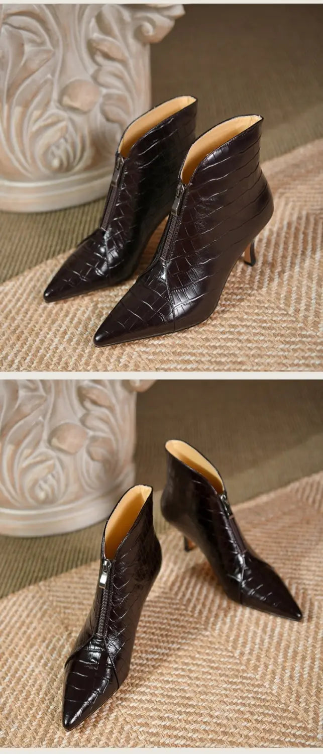 black crocodile embossed leather ankle boots with a pointed toe and slender stiletto heel