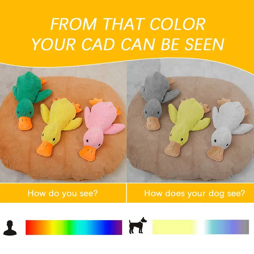 Soft plush calming duck toys for dogs in vibrant green yellow and pink with orange beaks designed for anxiety relief and quacking.