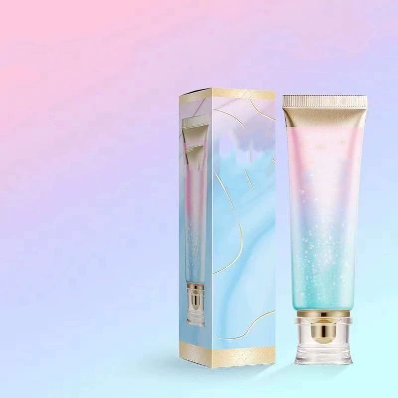 A gradient-hued iridescent tube of niacinamide brightening toothpaste for fresh breath 100g with a gold cap and clear base.