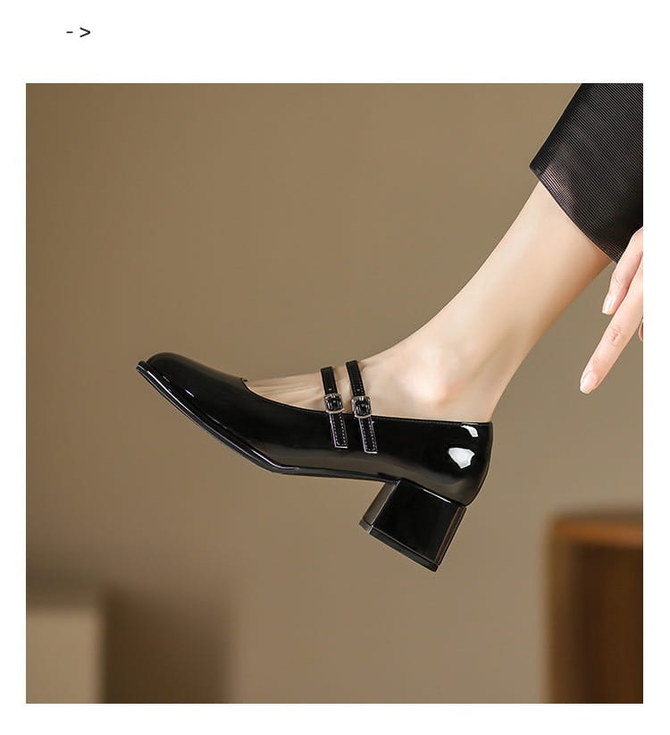 black patent leather mary jane shoe with a block heel and two buckle straps suitable for formal and casual wear