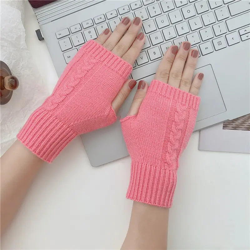 pink cable knit fingerless gloves made of woolen material with ribbed cuffs designed for unisex use