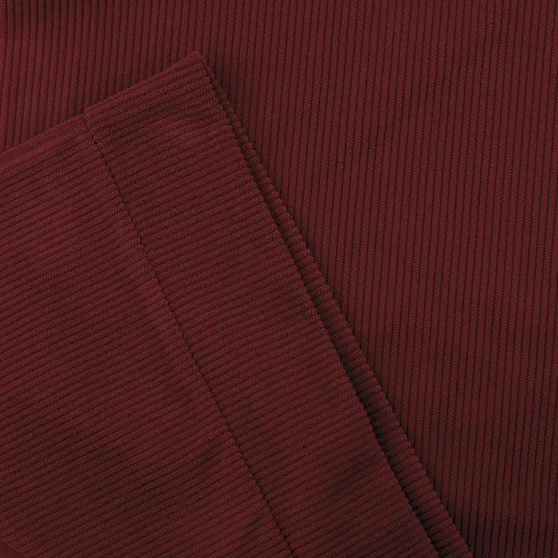 Slim fit corduroy patchwork pullover in rich burgundy fabric with prominent vertical ribs and contrast accents.