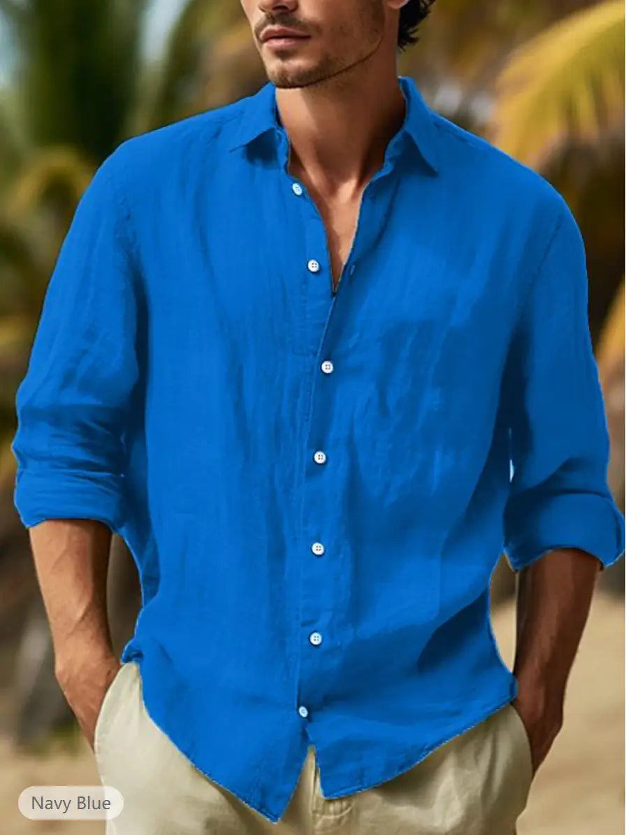 Men’s relaxed fit navy blue linen button-down shirt with rolled-up sleeves and white buttons made of cotton linen blend.