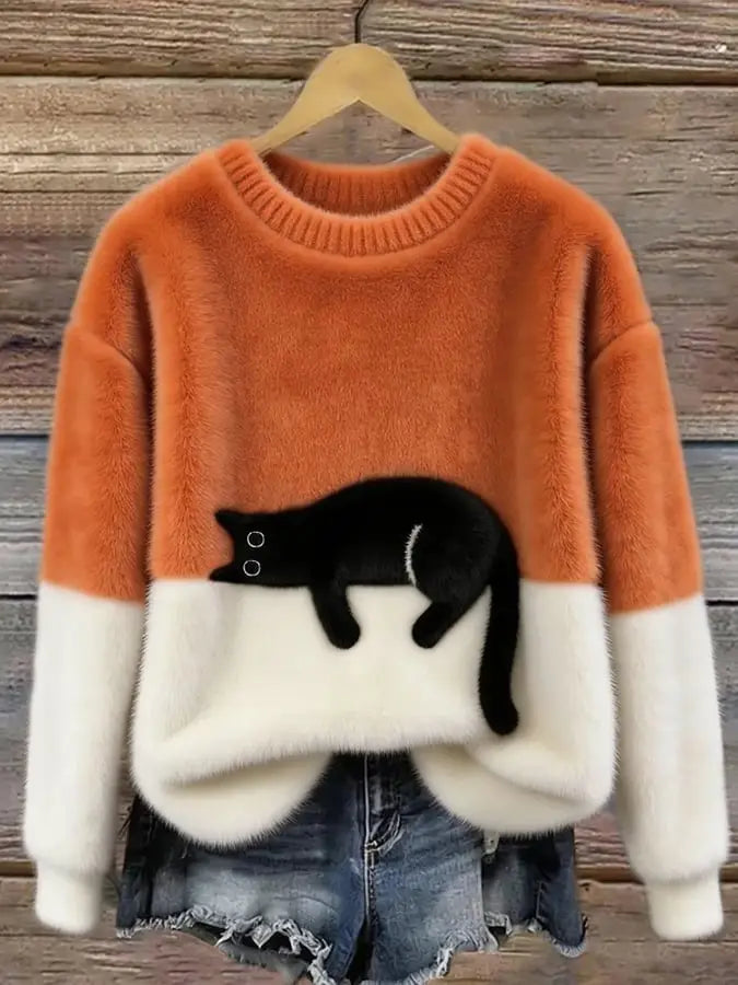 Orange-cremefarbenes farbblockiertes Fleece-Pulloveroberteil mit schwarzem Katzenapplikationsdesign für die Weihnachtszeit.