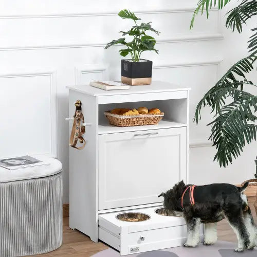 Station d’alimentation pour animaux en bois compact en blanc, avec deux gamelles métalliques et un tiroir extractible pour le rangement de la nourriture pour chien