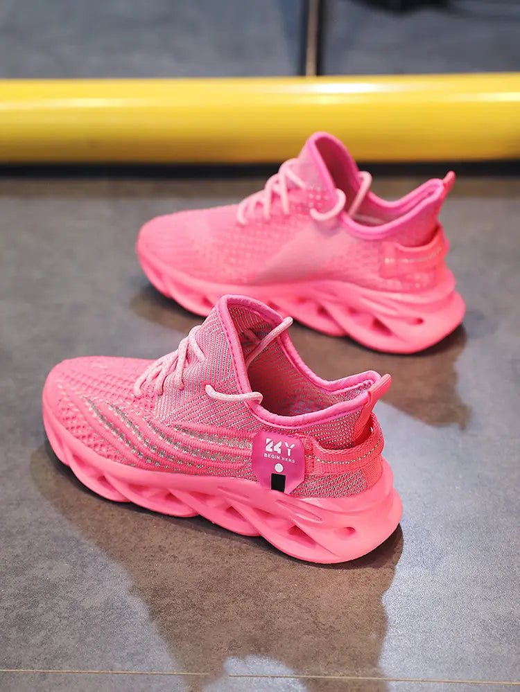 Bright pink flyknit mesh platform running shoes for men featuring a mesh upper and chunky translucent rubber sole.