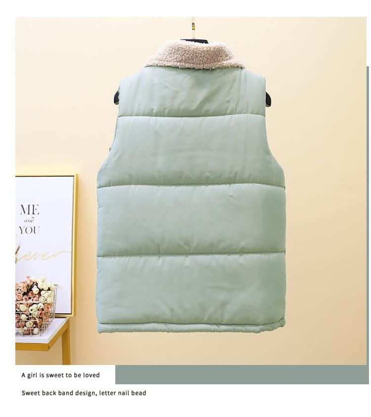 A mint green quilted shearling vest for women with a soft beige fleece collar.