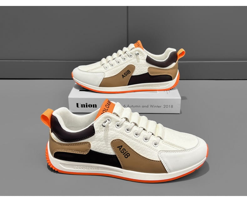 men’s casual sports sneakers featuring white tan and black asi8 design with orange accents on the soles and heel tabs made from non-slip microfiber material.