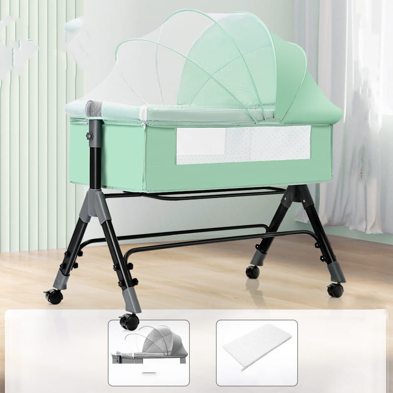 Mint green portable folding baby crib with black metal legs featuring caster wheels, transparent mesh canopy, mosquito net, and mattress.