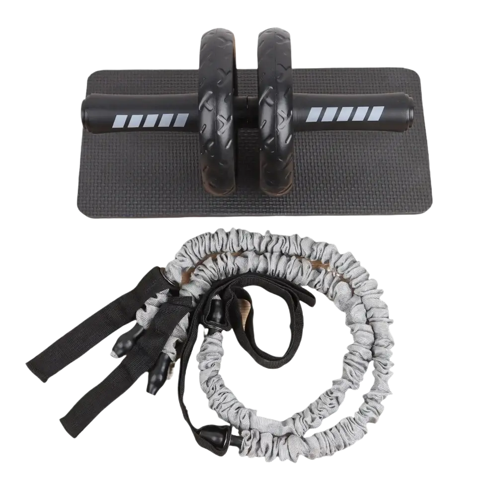Black ab roller wheel core workout resistance band set with textured grip and reflective stripes resting on black mat