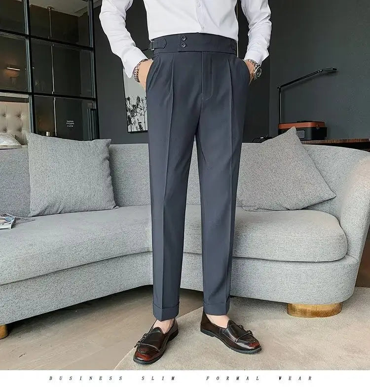 Dark gray Korean style slim fit men trousers with high waist pleats crafted from smooth fabric.