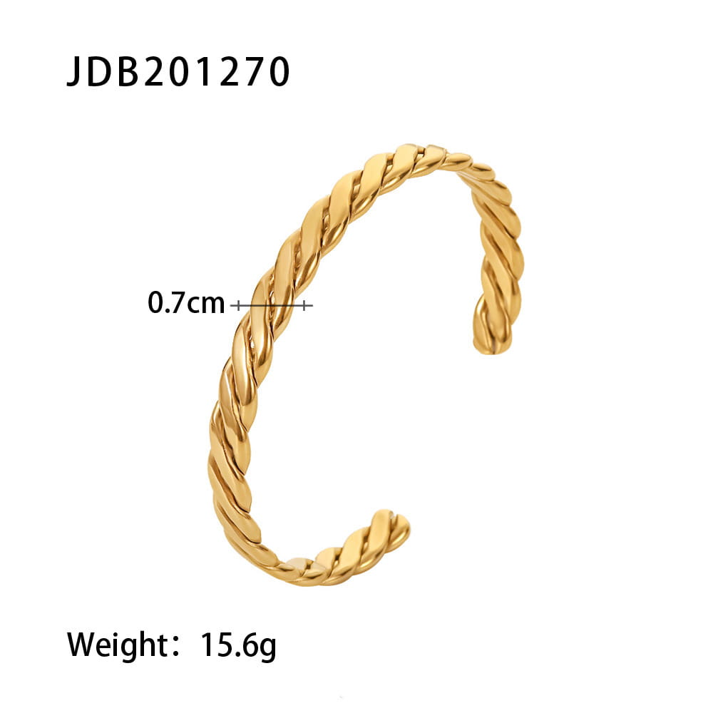 Gold plated stainless steel bangle bracelet with a gold-toned twisted rope and sleek open c-shape design featuring zirconia gemstones.