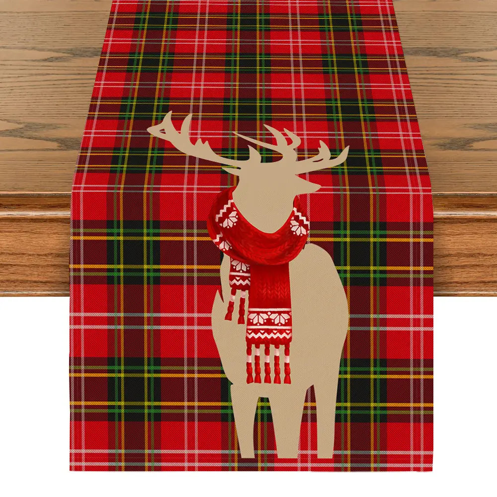 Christmas table runner festive holiday decor 183x33 featuring a red plaid design with a beige deer silhouette wearing a red patterned scarf.