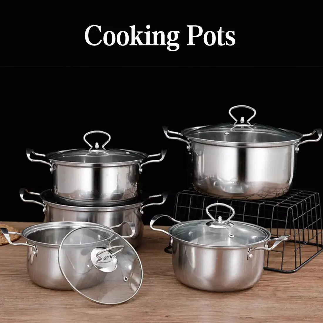 Set of stainless steel induction cookware 11 pieces featuring clear glass lids and sturdy handles for versatile cooking.