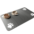 Gray herringbone-patterned absorbent food mat with waterproof rubber backing and white paw print decals for pet’s eating area