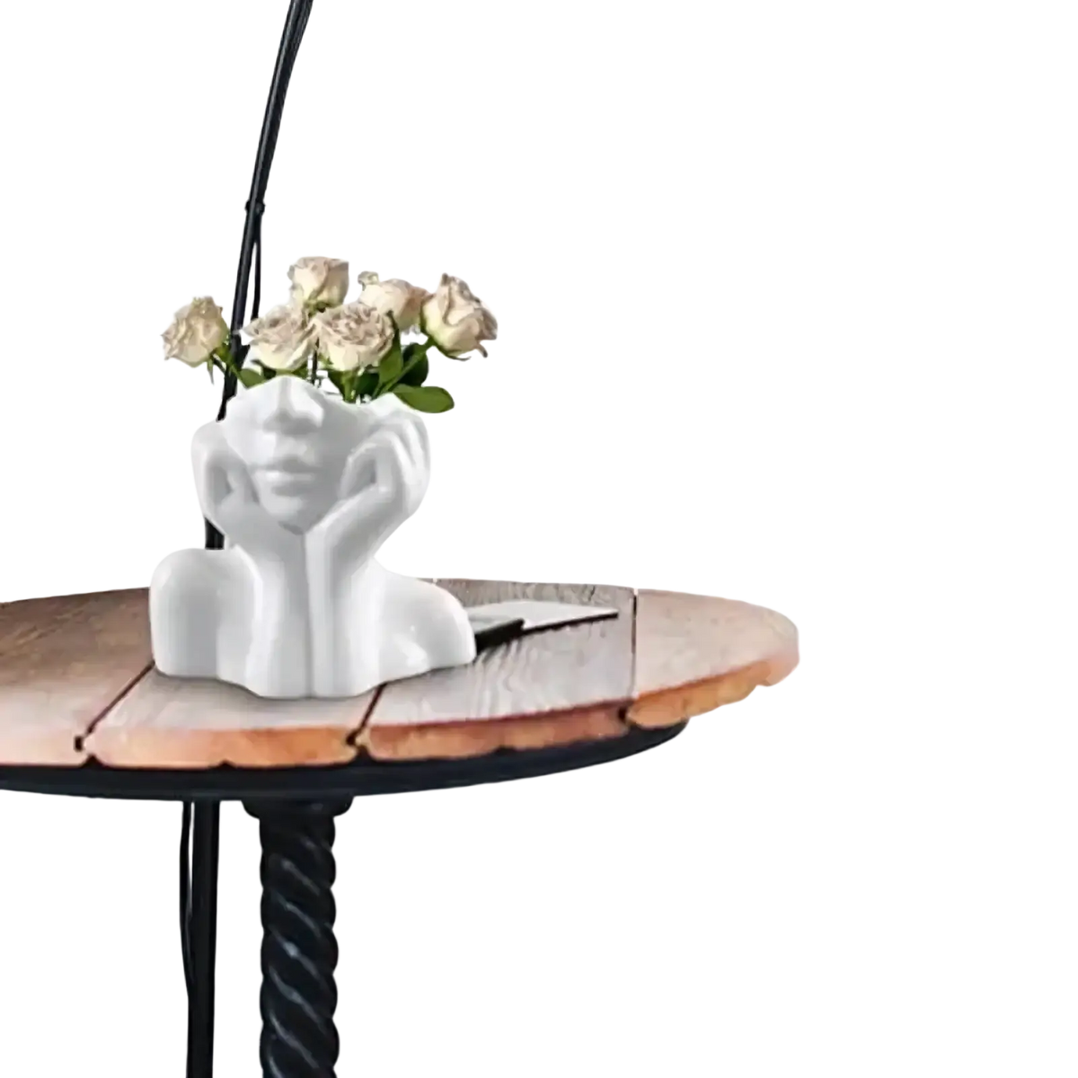 White ceramic abstract face makeup brush holder vase shaped as a woman bust holding pale roses framing her face
