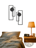 Black metal wall art 2 piece set featuring abstract geometric rectangular frames with circular cutouts