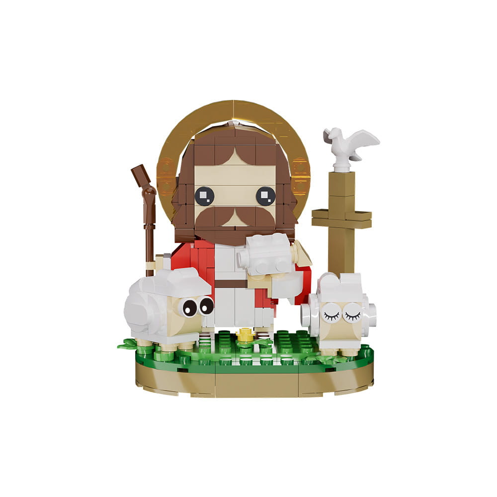 Un modèle de blocs de construction Jésus berger en Lego, merveilleusement détaillé, mettant en scène une figurine chibi anguleuse de style Jésus, aux cheveux bruns et à la barbe, en robes rouge et blanche, debout à côté de deux moutons sur une plaque de base verte.