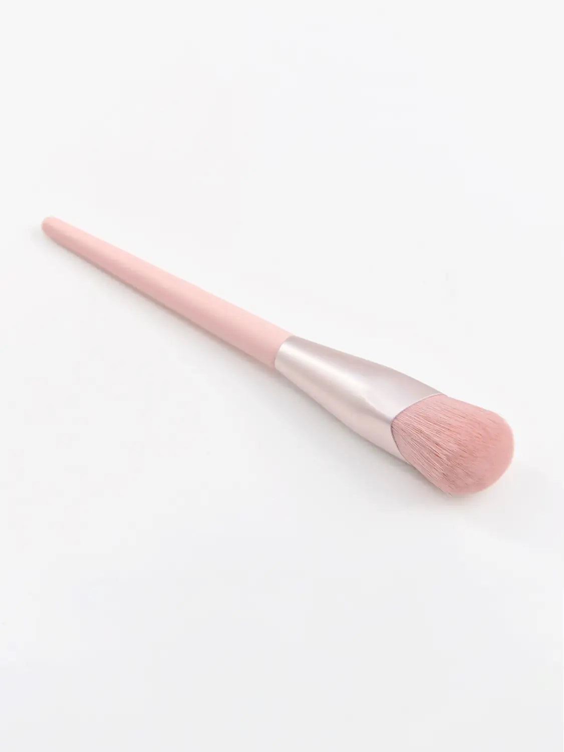 Finger belly makeup brush professional contour tool features a pink soft rounded bristles with a sleek matte-finished handle.