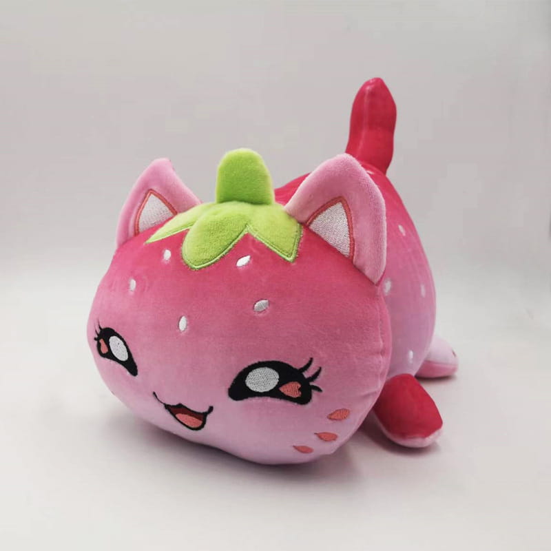A plush strawberry cat stuffed animal toy for kids 25cm with pink fur green leafy top and embroidered facial features.