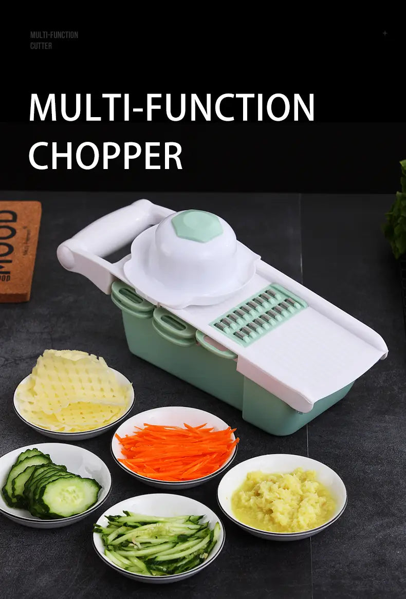 A sleek white and mint green vegetable slicer mandoline grater with blades and a rounded handle designed for efficient food preparation.