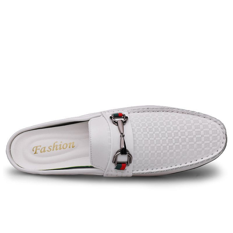 Men’s white leather mule loafers featuring woven slip-on design and a silver horsebit buckle with red and green accents.