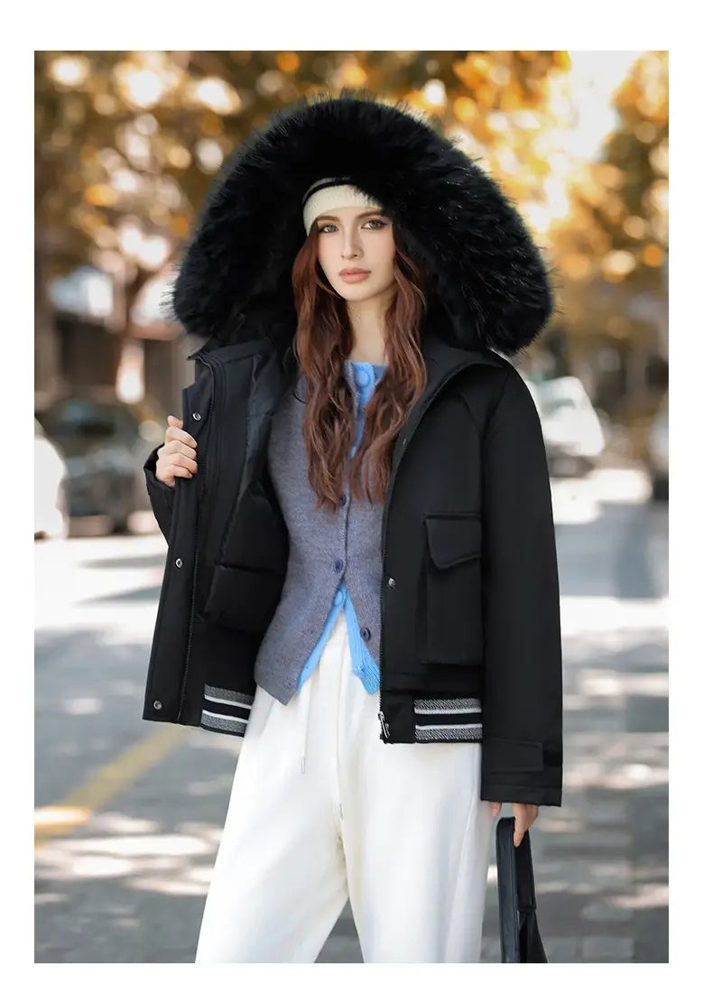 Black faux fur collar puffer jacket featuring a large fluffy fur-lined hood and striped cuffs.