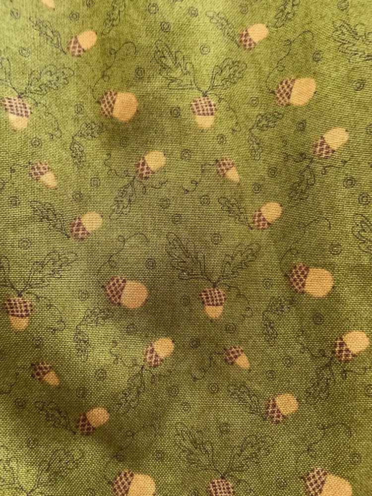 Retro acorn print cotton a-line dress with pockets featuring olive green fabric with tan and brown acorn and leaf pattern